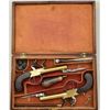 Image 2 : Cased pair of center hammer Flintlock pistols  with spring bayonets and constructed of  brass in ori