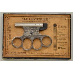 Le Centenaire percussion knuckle duster in  its original leatherette covered box with  velveteen lin