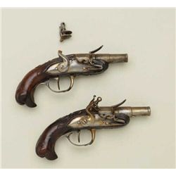 Pair of18th century French Flintlock pocket  pistols with carved bird head butts and  cannon barrels