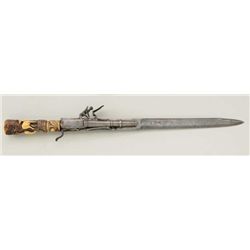 Flintlock boar hunting type sword with  ornately carved stag grip in Germanic style.   The blade mar
