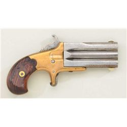 Frank Wesson 32 rim fire caliber over and  under derringer with brass frame, wood grips,  no serial 