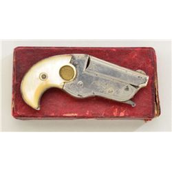 Hopkins & Allen 22 cal vest pocket derringer,  nickel plated with medallion pearl grips in  good con