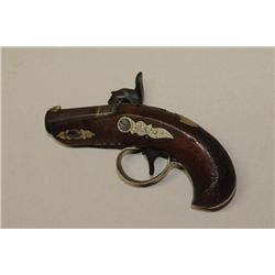 Henry Deringer (peanut sized) percussion  pistol showing 1 5/16” octagon barrel of .41  caliber with