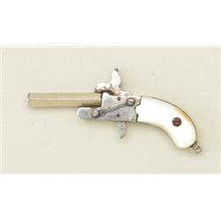 Miniature copy of a single shot derringer  approx. 2” overall in good condition with  functioning ac