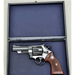Smith & Wesson Model 29, 44 magnum cal.  Double action revolver with 4” barrel,  checkered medallion