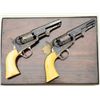 Image 1 : Fine pair of Gustave Young extra fancy  engraved Colt Model 1849 pockets with 4”  barrels, blue and 