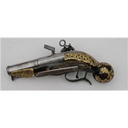 Miquelet flintlock ball butt pocket size  pistol with ornate pierced brass inlay circa  17th century
