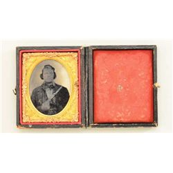 Tintype photograph of gentleman in business  suit holding unusual knife pistol, circa  1850s-60s. In