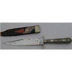 Clip point Bowie knife with cutlery handle  and original scabbard marked “Edward Barnes &  Sons”; fa