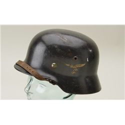 German WW II nazi era helmet showing dual  decals and original liner and strap. The left  side shows