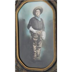 Framed hand-colored photograph of a cowboy,  image size approx. 17” x 10” in overall fine  condition