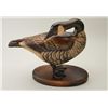 Image 1 : Art carving of duck nicely painted with  bronze feet, glass eyes, signed on base “Tom  Tab and John 