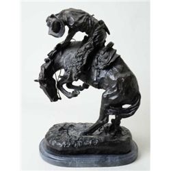 Older large re-cast of a Frederic Remington  bronze of a cowboy on bucking horse, on stone  base app