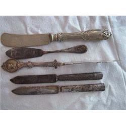 (5) Butter Knives to include: a) Hollow-ware, embossed pattern handle. No visible marks. 7" Lgth; b)