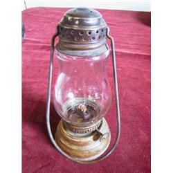 Brass Skater's Lantern. Tin bottom in very good condition. Original Globe, loop handle. 6 1/2" tall.