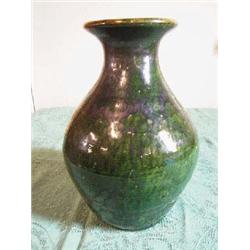 Unmarked redware pottery vase-wheel turned by hand. 12" tall, beautiful bold Green w/black cucumber.