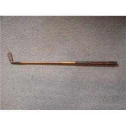 1890-1910 Mashie Niblick  Piccadilly  Putter. Wooden hickory handle, square dot clubface, leather gr