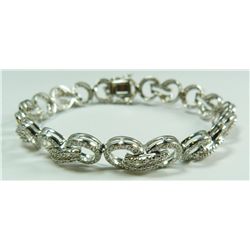 A 14K WHITE GOLD AND DIAMOND BRACELET
