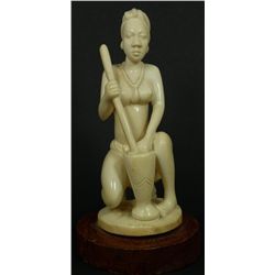 AN AFRICAN HAND CARVED IVORY FIGURE OF WOMAN