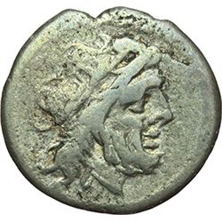 Roman Republican.    'Helmet' series. Victoriatus, ca 179-170. Obv.: Laureate head of Jupiter right.