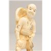 Image 2 : Carved bone figure "Man Holding Net"