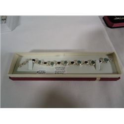 Sterling silver bracelet with genuine garnet and blue topaz