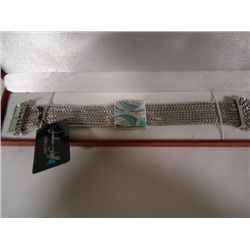 Joshua Lieff designer rhodium plated bracelet with enamel and clear