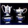 A PLAIN FOUR PIECE TEA SERVICE tea pot, water jug, sugar bowl and milk jug, raised on shaped foot, S