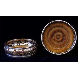 A PAIR OF VICTORIAN FOLIATE PIERCED WINE COASTERS with turned wooden bases, 5.5" diameter (2) £60-10