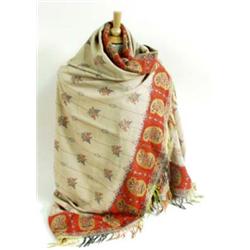 A PAISLEY SHAWL the ivory ground worked with all over floral motifs, with red paisley border and mul