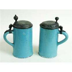 A PAIR OF LATE 18TH CENTURY EARTHENWARE TANKARDS/STEINS with pewter lids, 7.5  high £100-150...