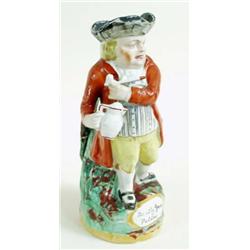 A LATE 19TH CENTURY STAFFORDSHIRE TOBY JUG "Hearty Good Fellow" with pipe and jug, in red coat and y