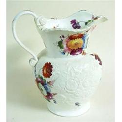 A HANDSOME OLD ENGLISH WHITE PORCELAIN JUG the body moulded raised flora and richly hand painted, as