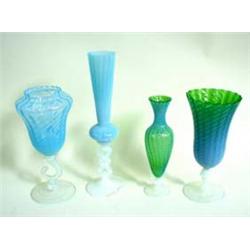 A RIBBED VASELINE STYLE OVERLAY AND GREEN GLASS VASE on opaque white knop stem with circular foot, 1