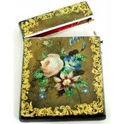 A VICTORIAN PAPIER-MACHE CARD CASE hand painted summer flowers within a gilt scroll border £100-150.