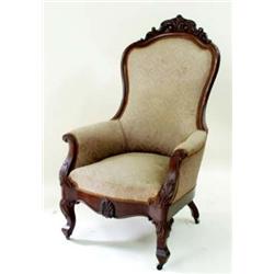 A VICTORIAN MAHOGANY ARMCHAIR with carved top rail, the arms with scroll ends, acanthus carved to kn