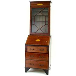 A SMALL EDWARDIAN MAHOGANY AND SATIN BANDED BUREAU BOOKCASE the top with moulded pediment over a gil