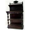 A LATE VICTORIAN DARK OAK BUFFET the back centred raised cresting with carved maskhead dividing fini