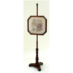 A VICTORIAN MAHOGANY POLE SCREEN the hand worked floral tapestry panel in moulded rectangular frame,