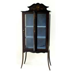 AN EDWARDIAN MAHOGANY STAINED DISPLAY CABINET with shallow shaped raised back, the top over a plain.