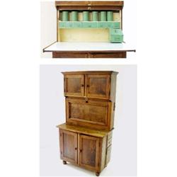 A "QUICKSEY" KITCHEN CABINET the top with panelled cupboard doors over a long panelled fall door wit