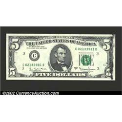 1977-A $5 Federal Reserve Note, Fr-1975-C, Gem CU. A minor ink smear is present on the right end of.