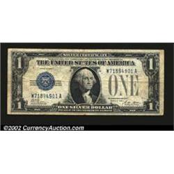 1928A $1 Silver Certificate, Fr-1601, Fine. A long vertical split is present from the top edge....