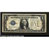 Image 1 : 1928A $1 Silver Certificate, Fr-1601, Fine. A long vertical split is present from the top edge....