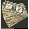 Image 1 : A miscellaneous group lot of small size notes, including 31 $1 Silver Certificates (all 1957s), one.