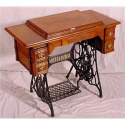 Lot 123: Victorian Iron and Oak Singer Treadle Sewing Machine