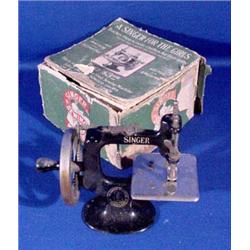 Lot 261: Miniature Toy Singer Sewing Machine with Box