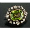 Image 1 : A late Victorian peridot and diamond brooch, centred with a canted-rectangular trap-cut peridot with