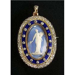 An early 20th century gold oval brooch/pendant, centred with a Wedgwood panel depicting a classical.