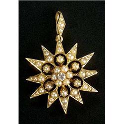 An Edwardian gold, half-pearl and diamond star brooch/pendant, of twelve rays centred with a small o